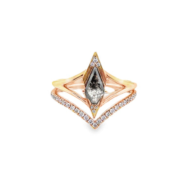 Rose gold ring with a central diamond on a white background